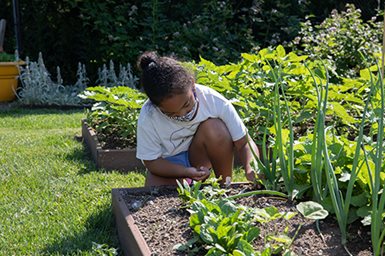 A Goryeb Children's Hospital patient participates in a horticulture therapy program aimed at improving mental and physical health while providing the opportunity to grow, harvest and eat their own food.