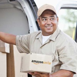 A delivery driver holding an AmazonSmiles box