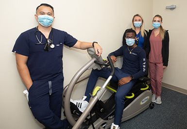 Gagnon Cardiovascular Institute pulmonary team members with the NuStep T4R Recumbent Cross Trainer purchased to enhance the cardiac patient mobilization program.