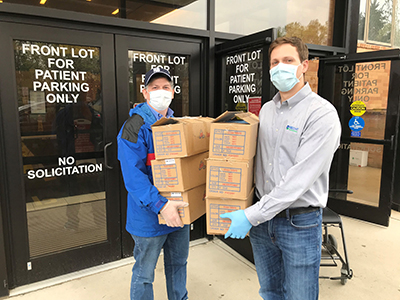Matthew Wizeman and Derek Becht of Becht Engineering delivering a donation of masks for frontline workers at Morristown Medical Center. 