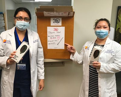 Pictured L-R: Nauka Thakker, NP, corporate health services for Morristown Medical Center and Ria Lam, NP, occupational medicine for Morristown Medical Center with hairbrush donations from Franco and Co. 